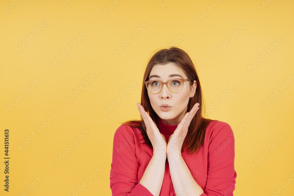 Young woman staring up in anxious trepidation Young woman staring up in anxious trepidation