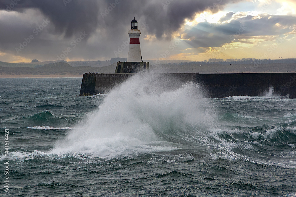 Misty and stormy day at Fraserburgh Harbour Lighthouse, Aberdeenshire, Scotland, UK.
