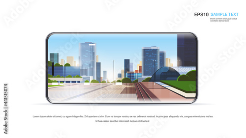 city skyscraper view on smartphone screen cityscape background realistic gadgets and devices concept