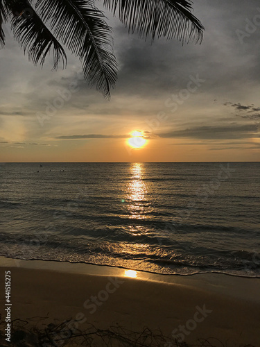 The setting sun reflects on the sea at Klong Chaow beach on Ko Kut in Trat, Thailand.