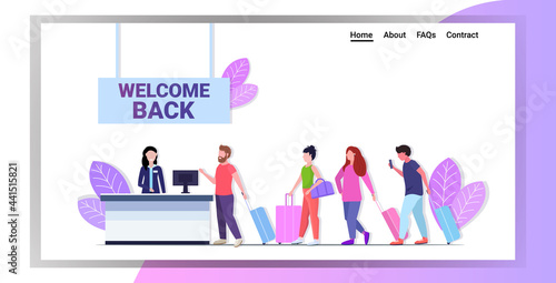 passengers standing in line queue at airport counter for check coronavirus pandemic quarantine is over