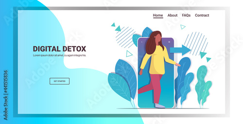 woman coming out of cellphone digital detox concept girl escaping from digital addiction