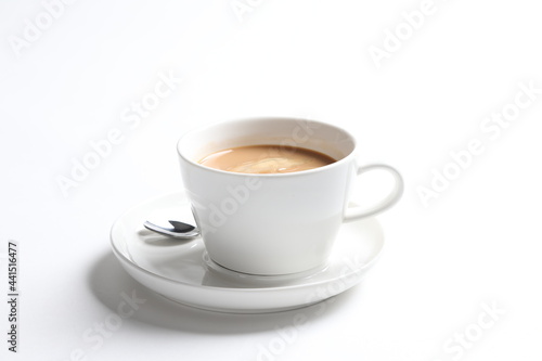 hot drink milk tea   milo   kopi coffee with milk in white cup and tea spoon and small plate in white background color beverage menu