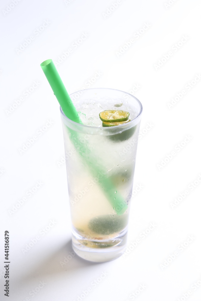 ice cold chilled fresh sour lime fruit honey drink in glass and green straw beverage menu in white background ice cold chilled fresh sour lime fruit honey drink in glass and green straw beverage menu in white background