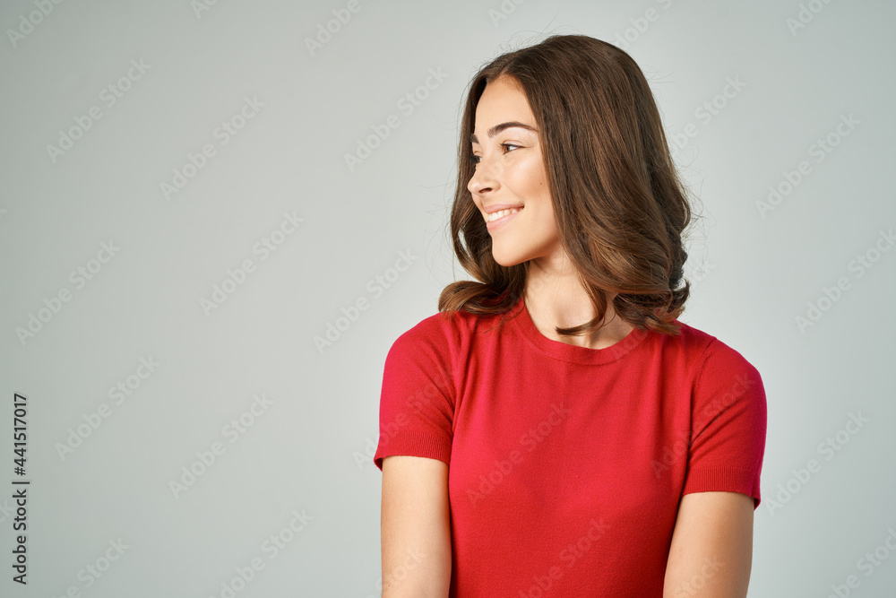 pretty brunette in red t-shirt posing fashion studio pretty brunette in red t-shirt posing fashion studio
