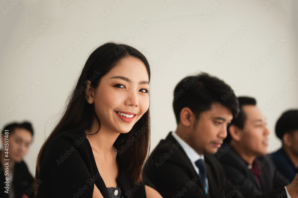 Beauty women smile sitting in group business meeting Beauty women smile sitting in group business meeting