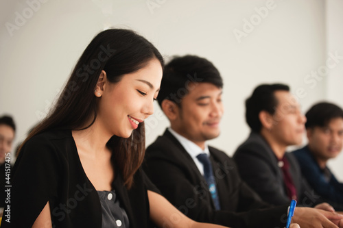 Beauty women smile sitting in group business meeting