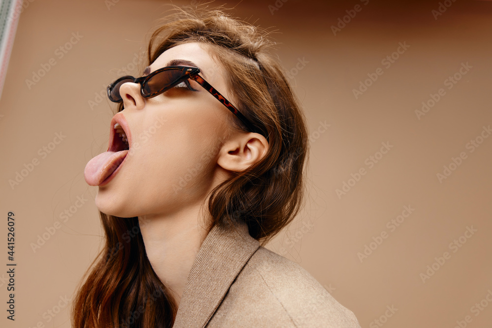 emotional woman showing tongue to the side grimacing glasses model emotional woman showing tongue to the side grimacing glasses model