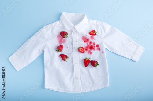  Complex strawberry spot on a white shirt. isolated © HalynaRom