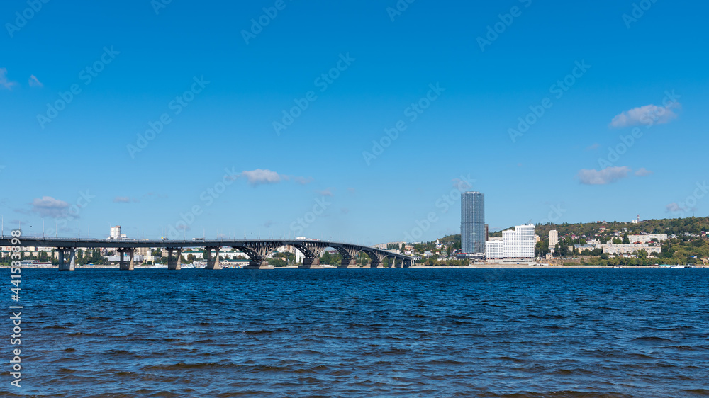 View of the big bridge across the Volga near the city of Saratov on a bright sunny day