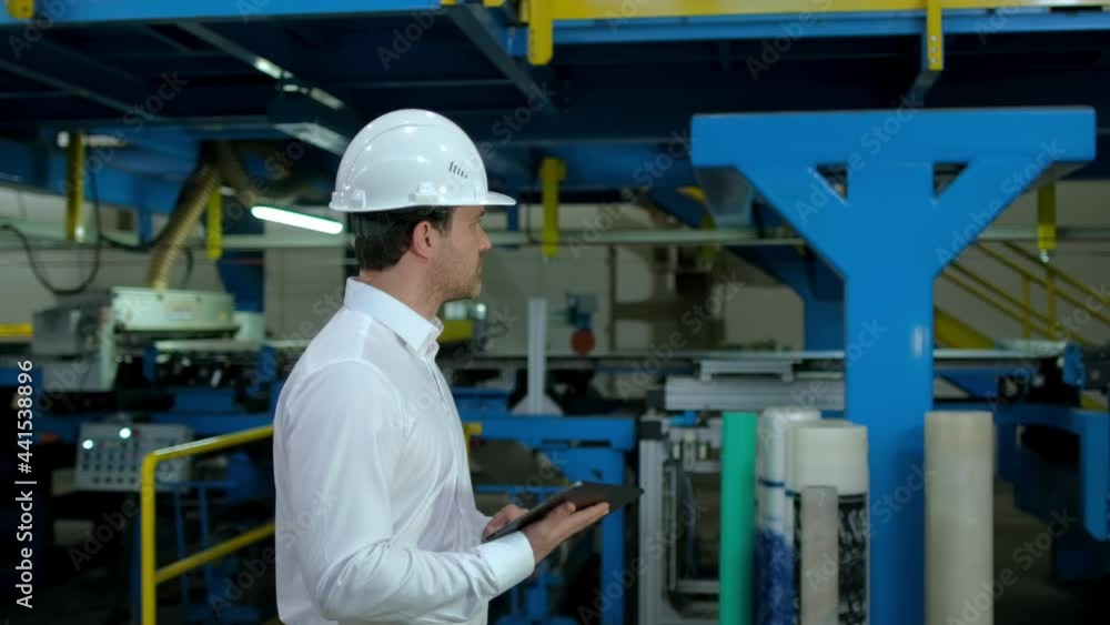 Architect male engineer man businessman in hard hat using tablet computer, engineering manufacture plant factory, worker working on production line in modern manufacturing Industry, business people Architect male engineer man businessman in hard hat using tablet computer, engineering manufacture plant factory, worker working on production line in modern manufacturing Industry, business people