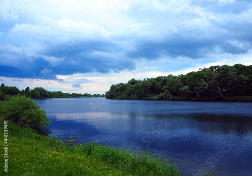 The blue river flows through the forest