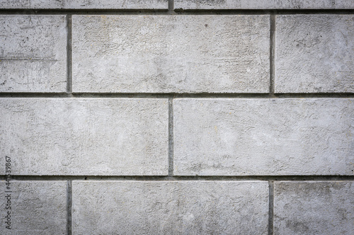 Grey grungy concrete wall rectangular tiles