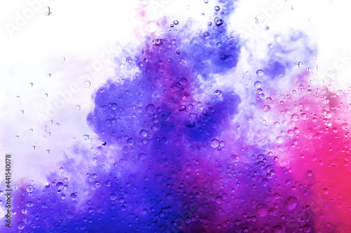 Beautiful colorful background with glitter and colored bubbles in oil and watercolor. Sparkle particles. Macro oil ink bubbles and drops. Abstract template acrylic paint texture. Colored Wallpaper