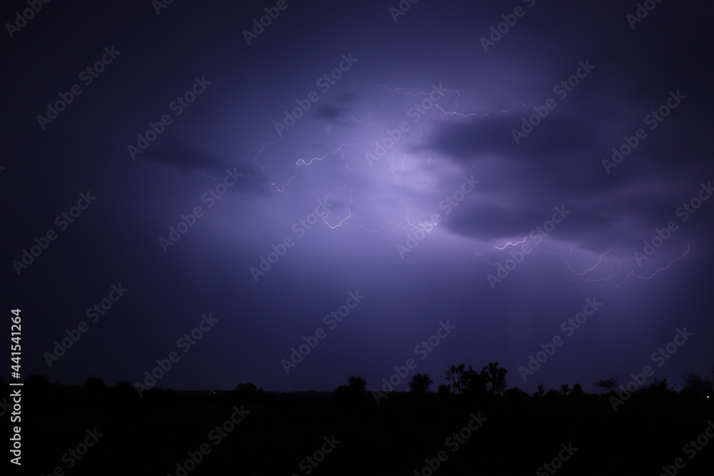 Lightning strikes at night during a severe thunderstorm