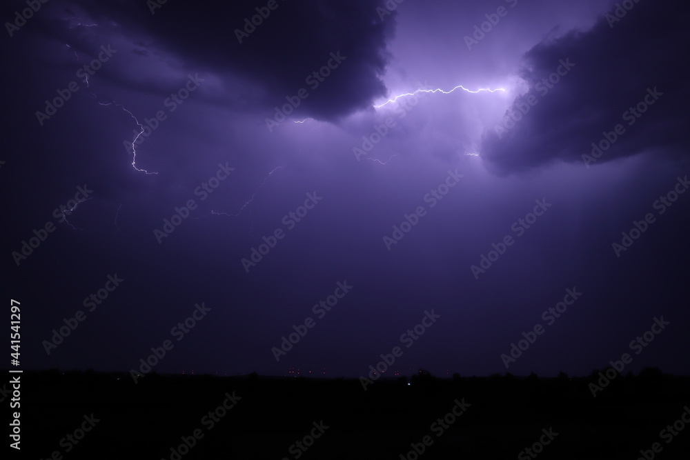 Lightning strikes at night during a severe thunderstorm Lightning strikes at night during a severe thunderstorm