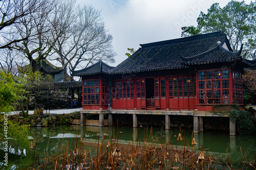 red wooden wall pavilion in the Suzhou garden, interesting place to visit , travel, rest, meditation