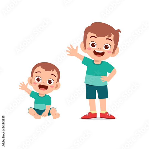 cute little boy say hello with young brother