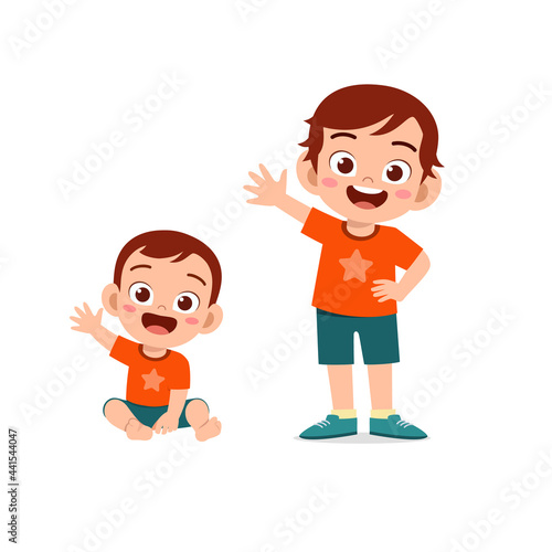 cute little boy say hello with young brother