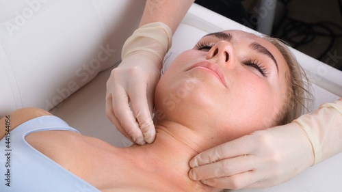 Chin massage of woman young woman during face massage at beauty salon