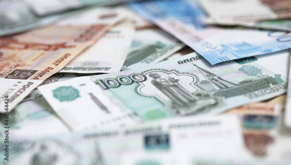 Russian money. Space for copy. Banknotes of different denominations. Concept of financial well-being. Close-up of Russian rubles. Finance concept. Background and texture of money. Russian money. Space for copy. Banknotes of different denominations. Concept of financial well-being. Close-up of Russian rubles. Finance concept. Background and texture of money.