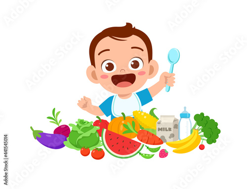 cute little baby boy eat fruit and vegetable