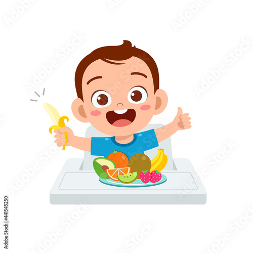 cute little baby boy eat fruit and vegetable