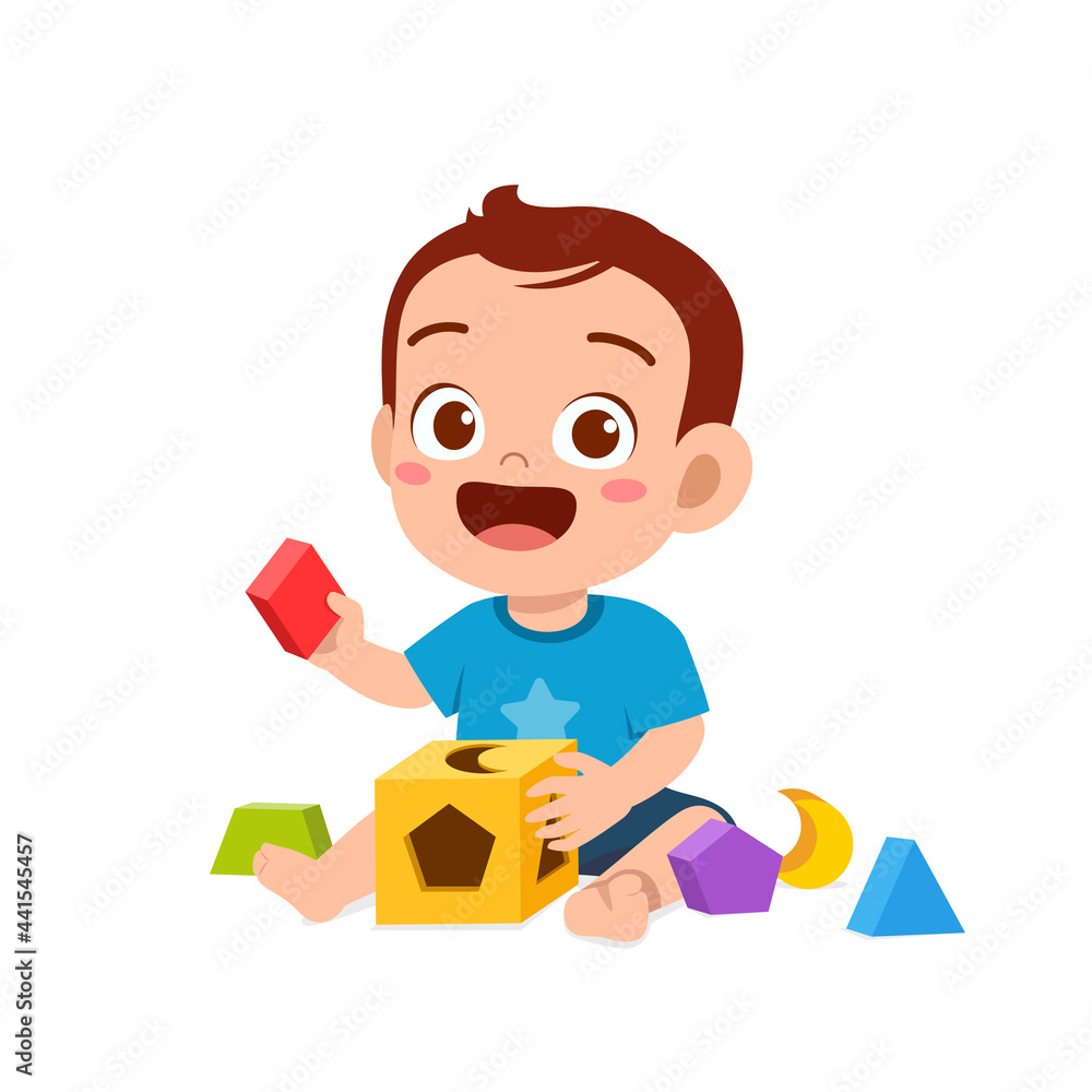 cute little baby boy playing with colorful puzzle