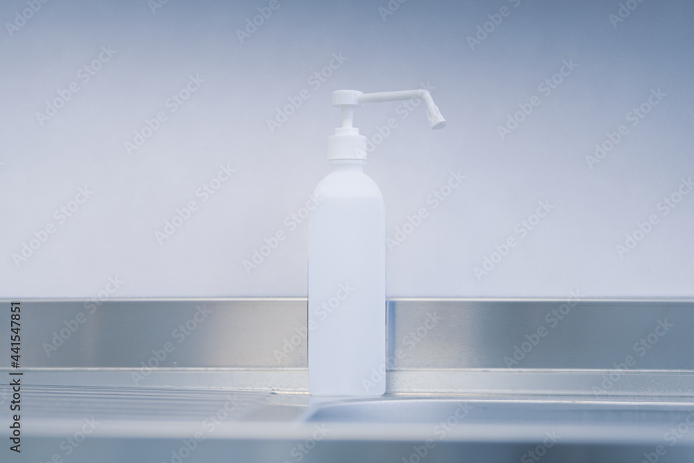 Disinfectant dispenser next to a sink inside an emergency room. Medical equipment. Disinfectant dispenser next to a sink inside an emergency room. Medical equipment.