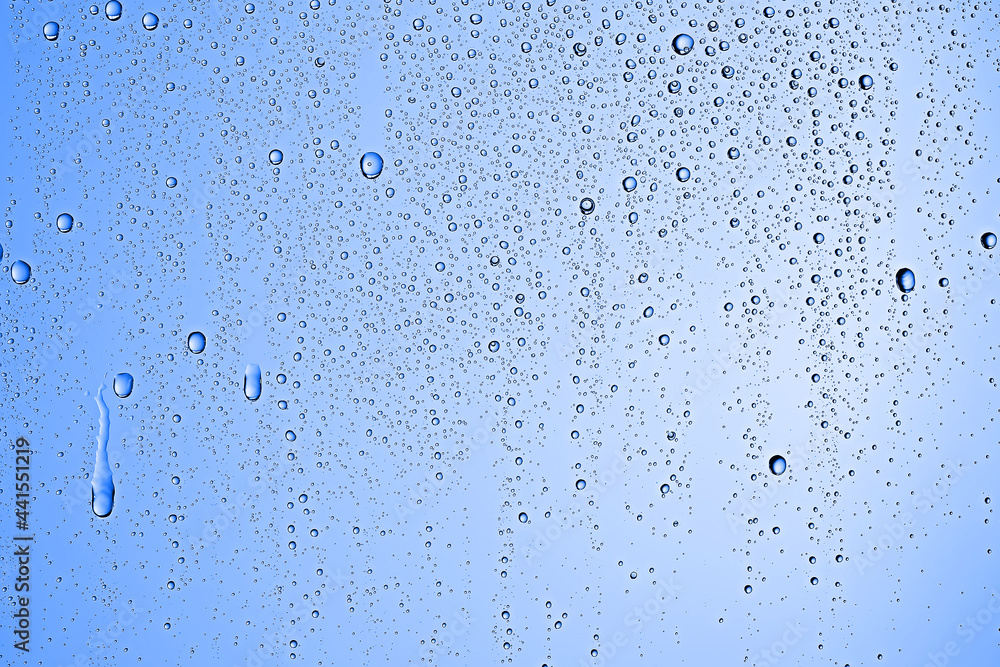 fresh drops background blue glass / wet rainy background, water drops transparent glass blue