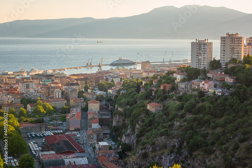 Scenic panoramic view of Rijeka port city on Adriatic seacoast from Trsat castle, beautiful cityscape in sunset light, Kvarner bay, Croatia. Outdoor travel background
