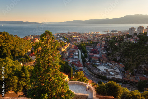 Fototapeta Naklejka Na Ścianę i Meble -  Scenic panoramic view of Rijeka port city on Adriatic seacoast from Trsat castle, beautiful cityscape in sunset light, Kvarner bay, Croatia. Outdoor travel background