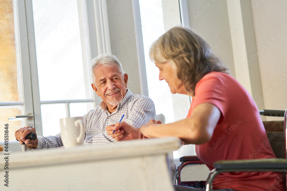 Obraz premium Retired senior couple solving puzzles as memory training