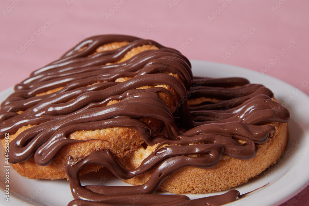 fresh pancake in a plate poured with chocolate paste, cream on buns, pancakes with chocolate fresh pancake in a plate poured with chocolate paste, cream on buns, pancakes with chocolate