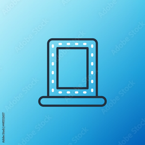 Line Makeup mirror with lights icon isolated on blue background. Colorful outline concept. Vector