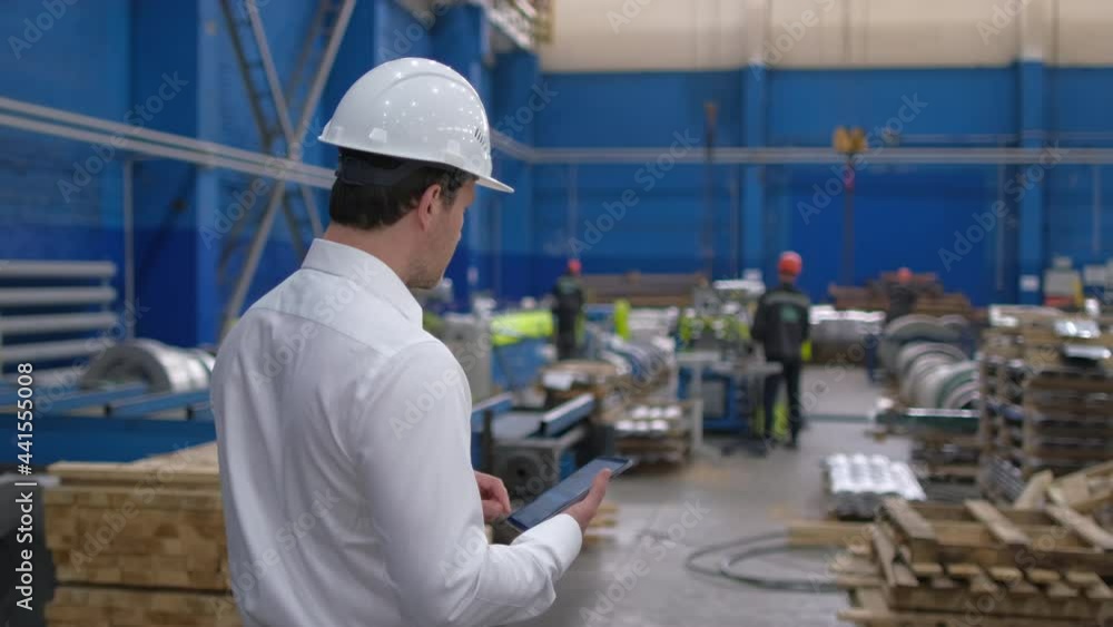 Architect male engineer man businessman in hard hat using tablet computer, engineering manufacture plant factory, worker working on production line in modern manufacturing Industry, business people Architect male engineer man businessman in hard hat using tablet computer, engineering manufacture plant factory, worker working on production line in modern manufacturing Industry, business people