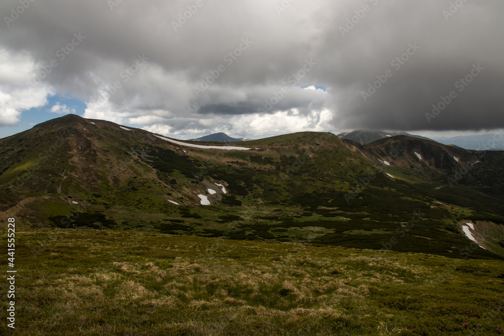 mountains in summer in the clouds