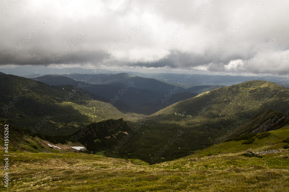 mountains in summer in the clouds