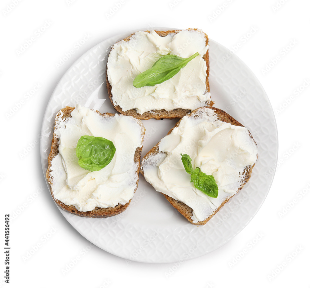 Bread with cream cheese and basil on white background, top view Bread with cream cheese and basil on white background, top view