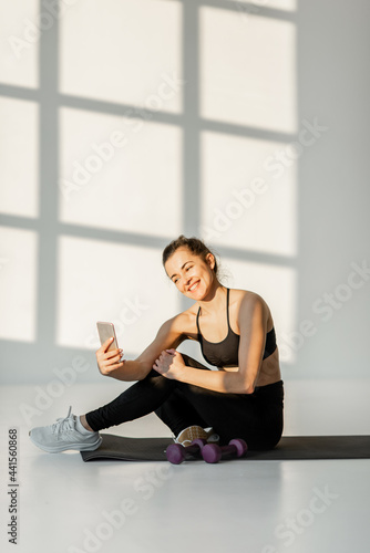 Happy athletic woman make selfie photo or vlogging on phone during fitness training. Healthy lifestyle, social activity on the Internet about sports Free Download Happy athletic woman make selfie photo or vlogging on phone during fitness training. Healthy lifestyle, social activity on the Internet about sports - GFXLoad