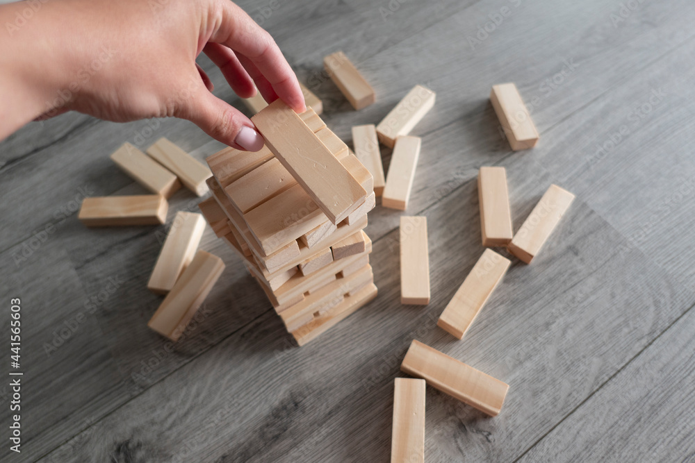 board game Jenga tower of wooden blocks board game Jenga tower of wooden blocks