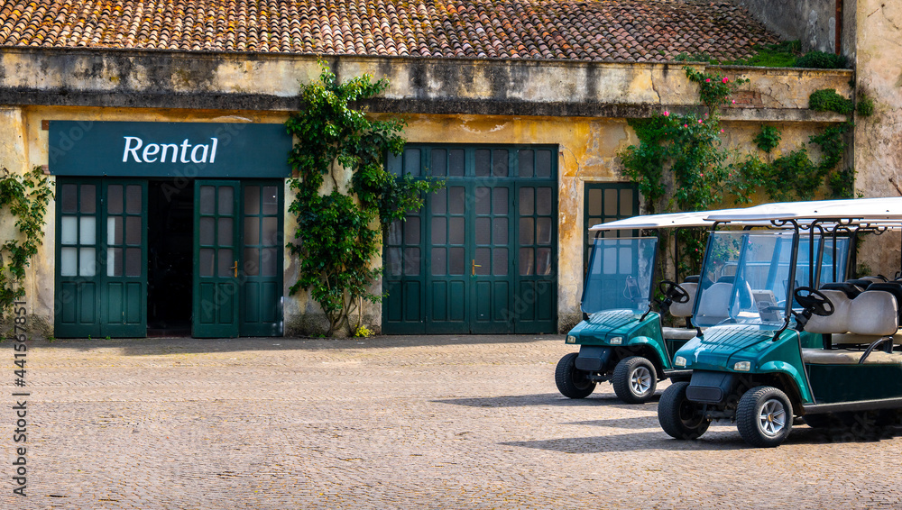 golf cart buggy rental parking at golf course Photos | Adobe Stock