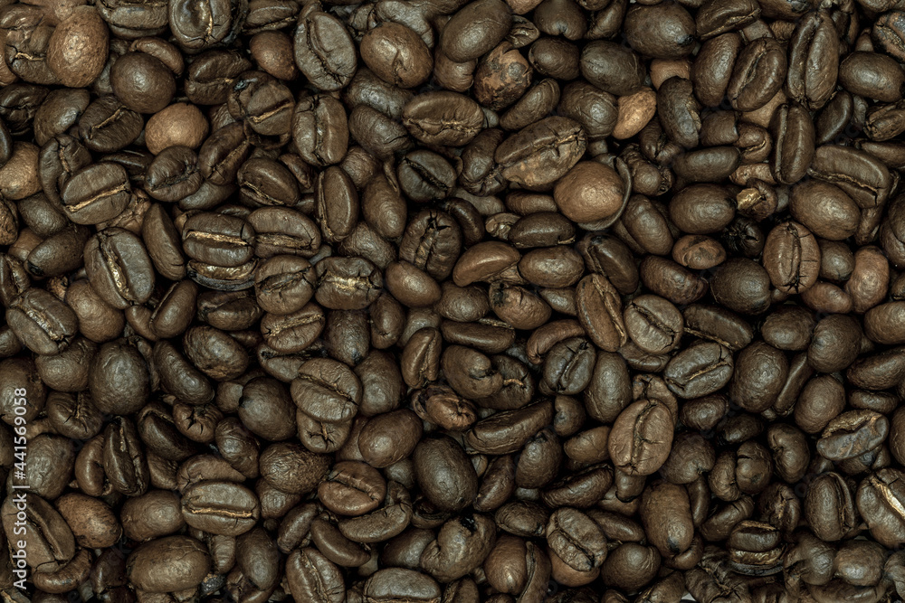Naklejka premium Kaffeebohnen bildfüllend close up macro