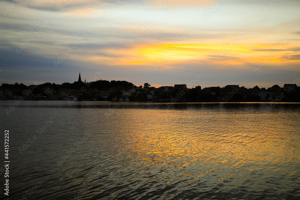 View to the island town Malchow during sunset, Mecklenburg Western Pomerania - Germany View to the island town Malchow during sunset, Mecklenburg Western Pomerania - Germany