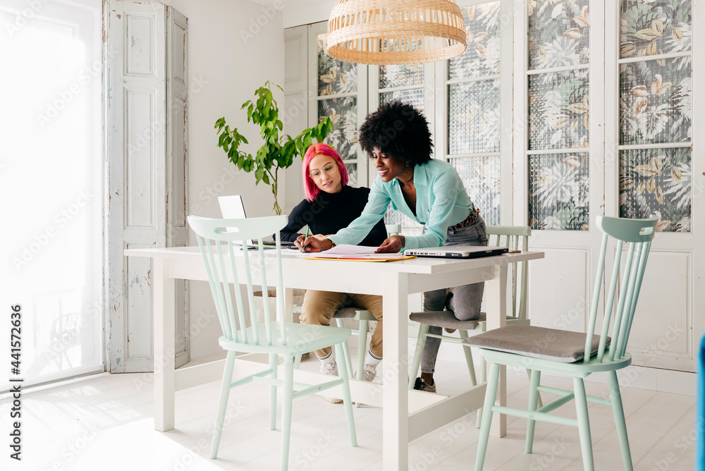 Creative female designers working at home Creative female designers working at home