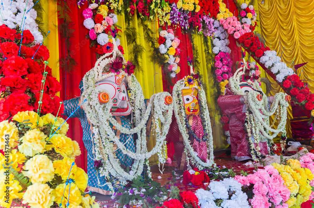 Fototapeta premium Idol of God Jagannath, Balaram and Suvodra is being worshipped. Ratha jatra festival at Howrah, West Bengal, India.