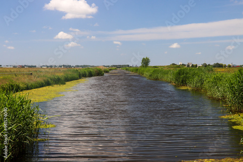 Fototapeta Naklejka Na Ścianę i Meble -  The lowest polder in the Netherlands named Zuidplaspolder with water canal to bring water to pumping station