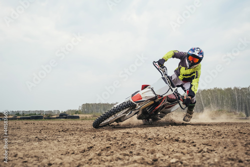 Motorcyclist falling at enduro motocross training ground