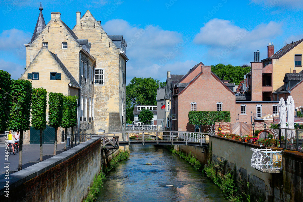 The River Geul flowing past historic buildings in the town of Valkenburg aan de Geul in the province of Limburg in the Netherlands.
