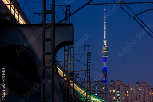The electric train left a beautiful trail of headlights behind it